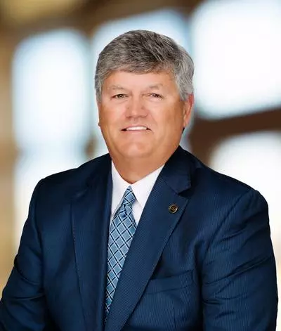 City Attorney Tom Trask in blue suit